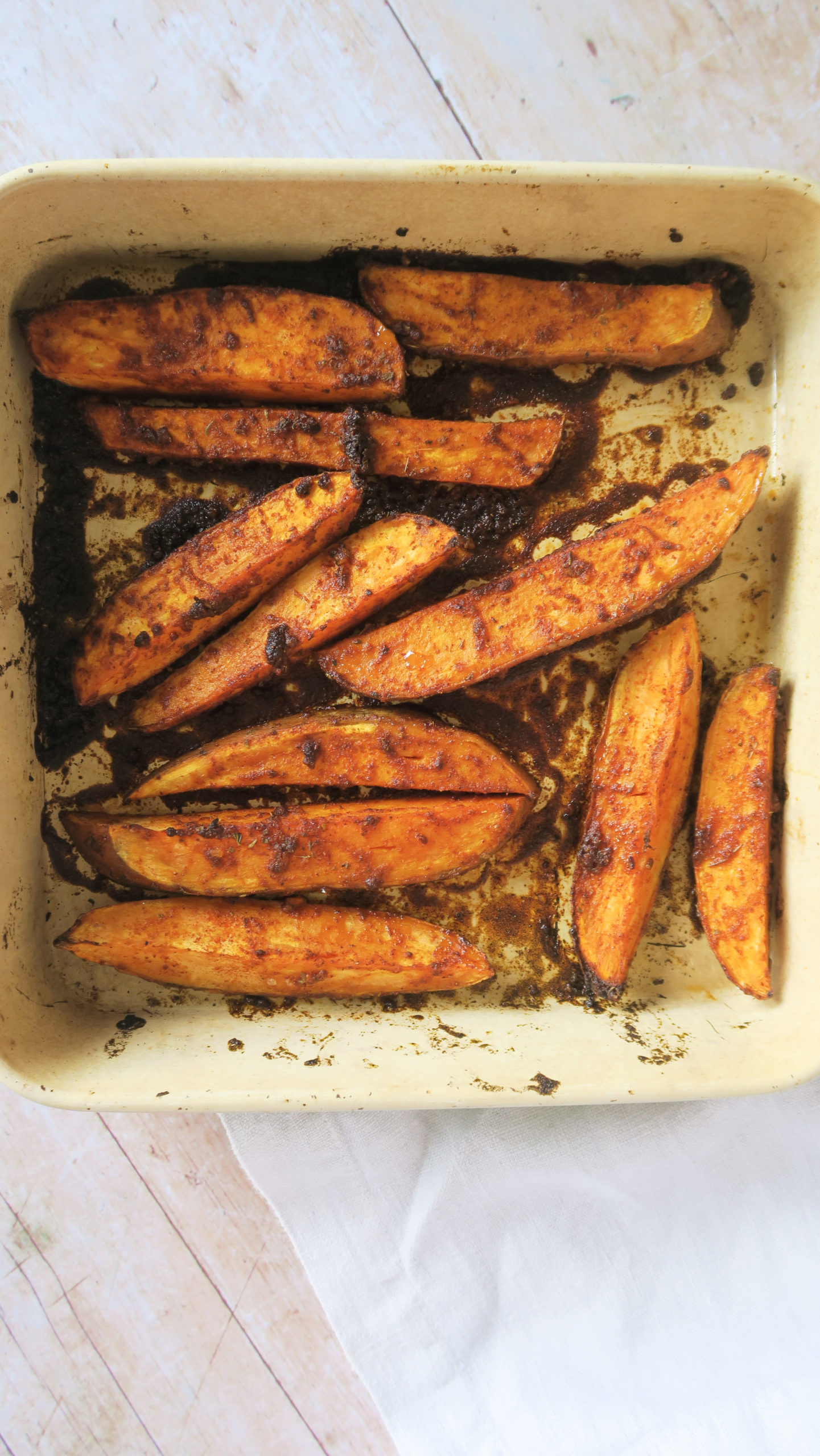 Sweet potato wedges roasted in a baking tray