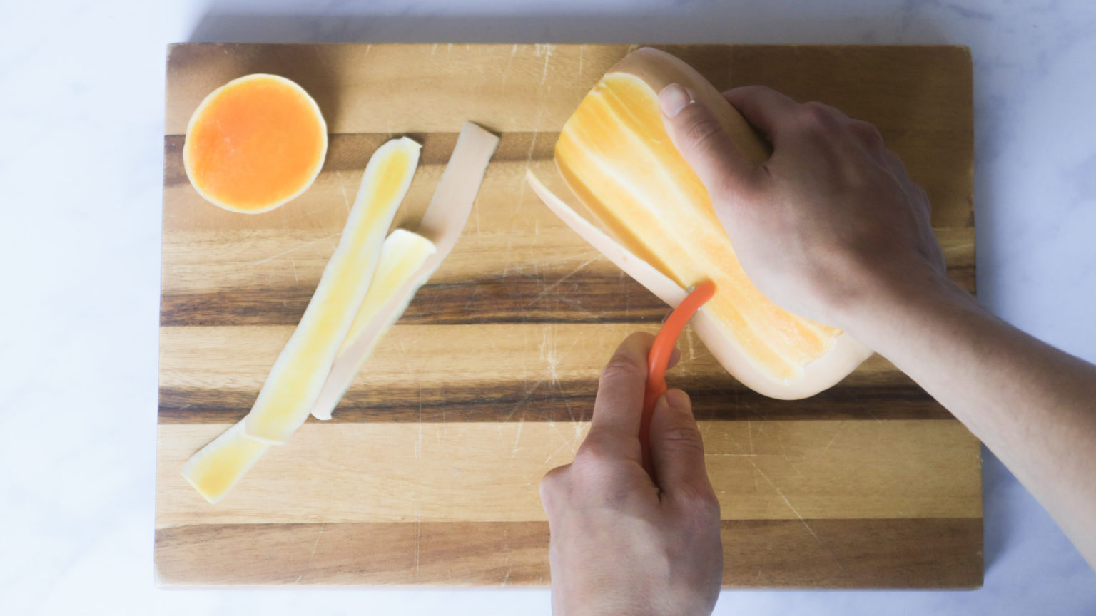 Showing how to peel a squash