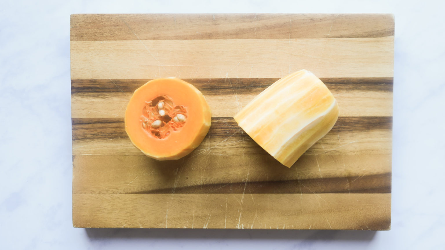 Showing where to cut the butternut in half