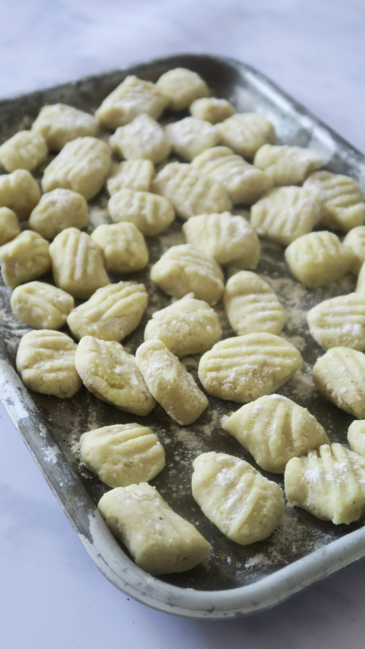 Silver tray with gnocchi before cooking