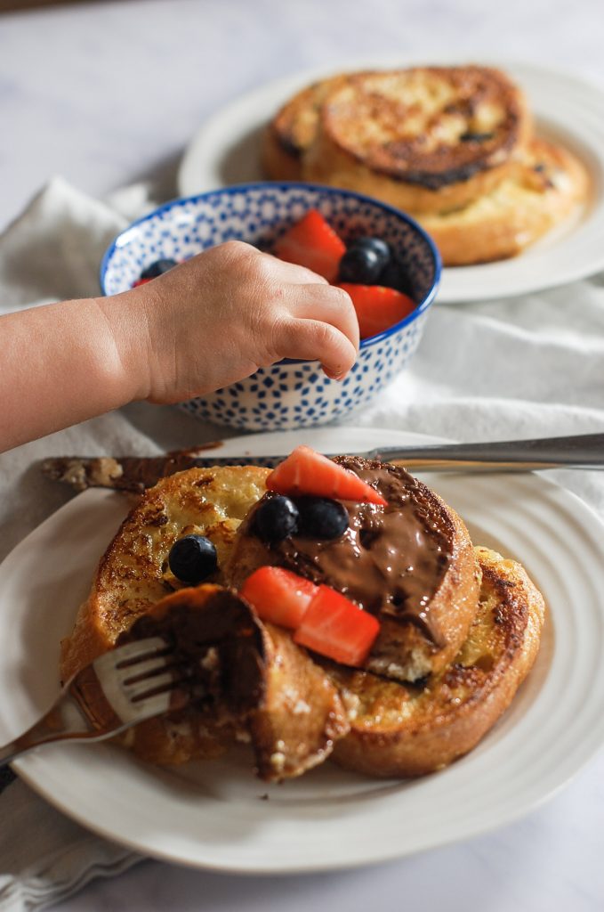 Spanish style French toasts - my little one's hand trying to steal some fresh berries!