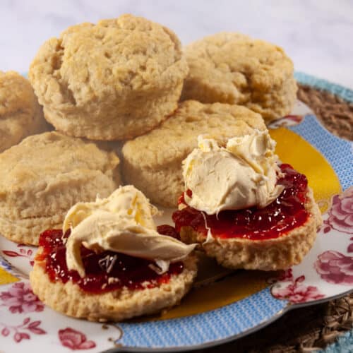 buttermilk scones with jam and cream on a plate