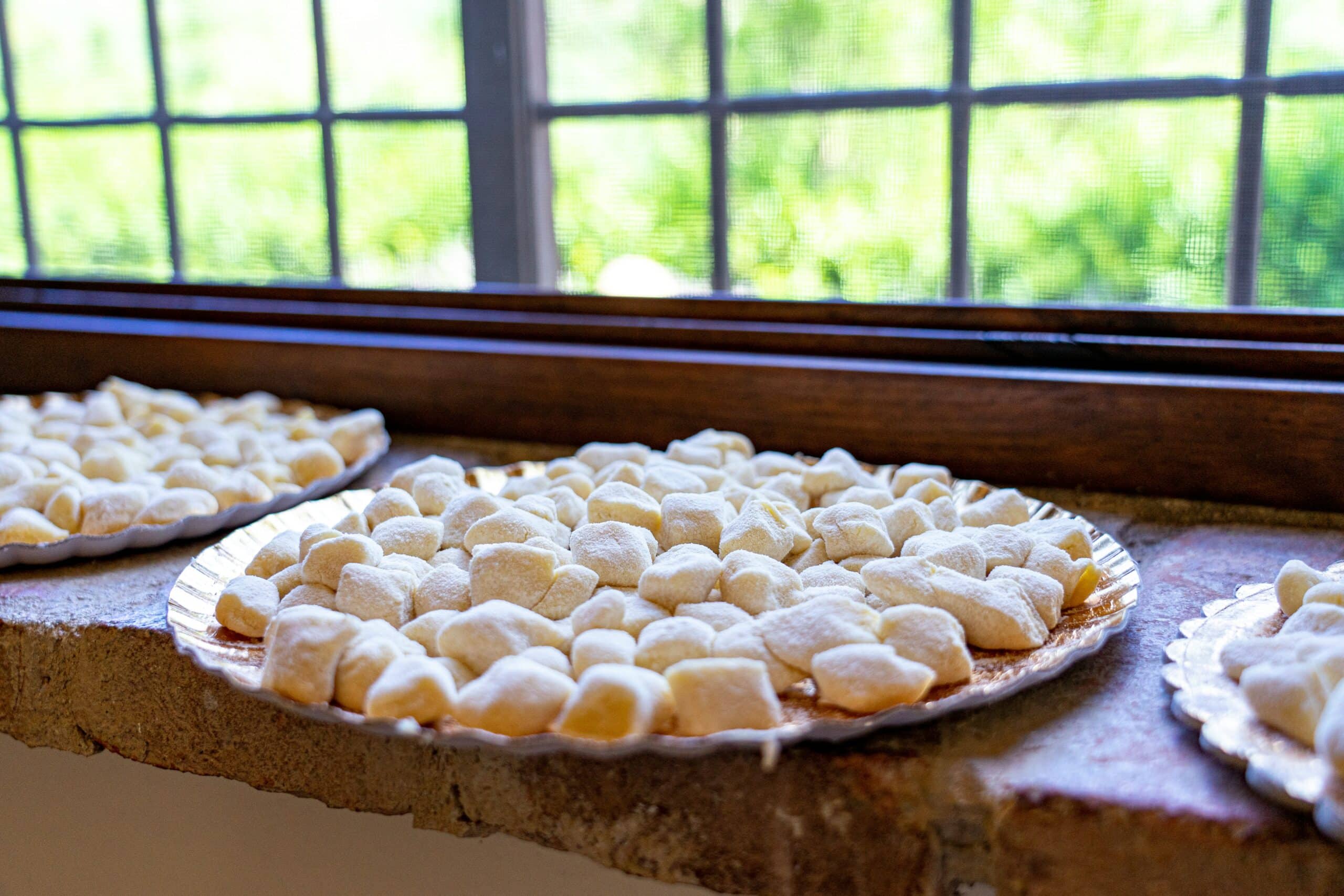 Fresh gnocchi on a plate by a window.Photo by Nils Schirmer on Unsplash