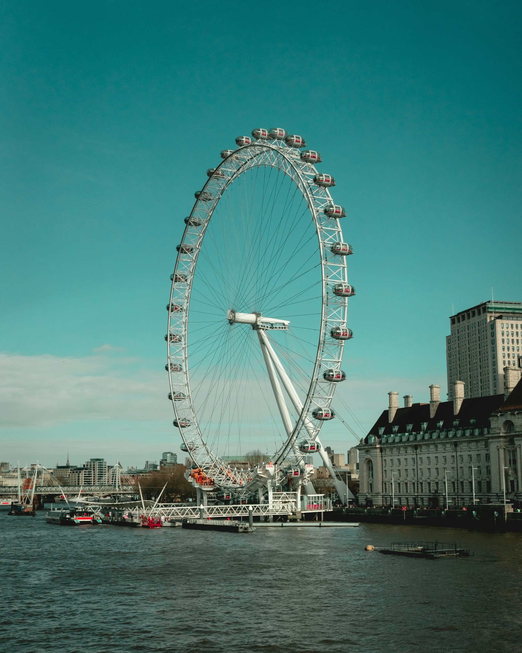 The London eye from across the water. Photo by Radu Ioan Iancu on Unsplash.